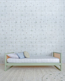 Cama Casinha Palha Evolutiva 4 em 1 na cor Verde, em modo sofá, vista em ângulo no quarto.